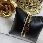 Gold-Toned Bangle Bracelet Featuring Embedded Crystals Line & A Charm Of Cross Floral Design