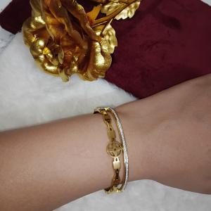 Gold-Toned Bangle Bracelet Featuring Embedded Crystals Line & A Charm Of Cross Floral Design