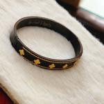 Van Cleef & Aepels Unisex Black Alhambra Bracelet With Gold Clover Charm