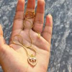 Elegant Gold-Plated Heart Pendant Necklace with Crystal Bow Accent