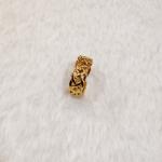 A Gold Celtic Knot Ring, Specifically A Claddagh Ring