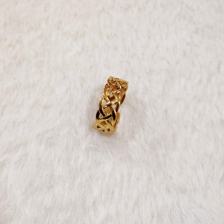 A Gold Celtic Knot Ring, Specifically A Claddagh Ring